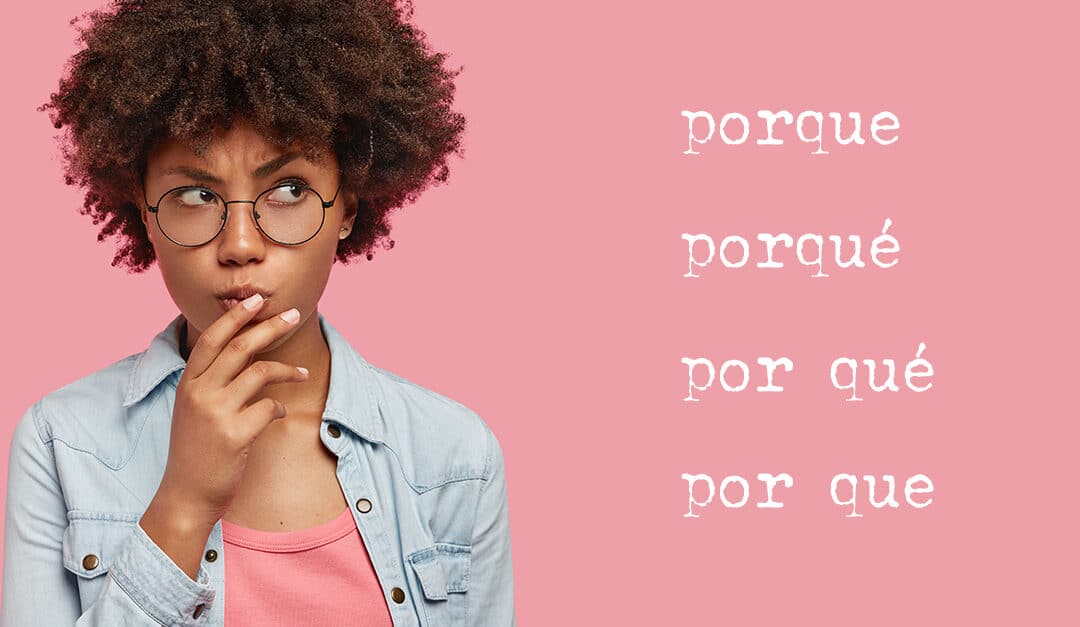 Pensive attractive curly African American female being deep in thoughts, raises eyebrows, curves lips, holds chin, wears fashionable clothes, stands against pink wall with the words Porque, Porqué, Por qué, Por que