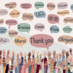 Illustrated banner with many raised hands of people diversity from different nations and continents with speech bubbles with text "thank you" "thanks" in different international languages