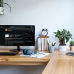 Desk in a sunny room at home with the subreddit r/Spanish on the monitor, illustrating the blog topic Learn Spanish with Reddit