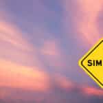 Yellow transportation sign with word similar on violet color sky background, illustrating the blog topic "Near-Perfect Cognates in English and Spanish"